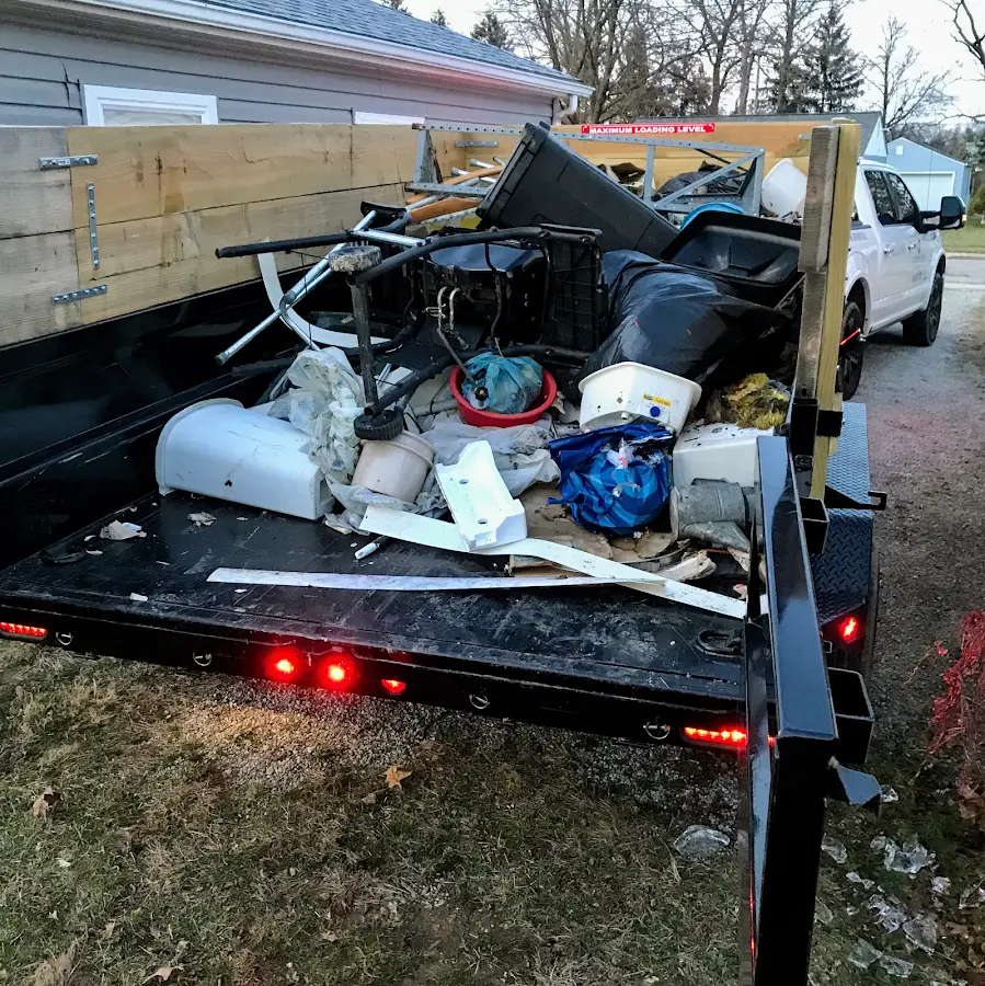 Roll-off dumpster delivered to a residential driveway in Adel